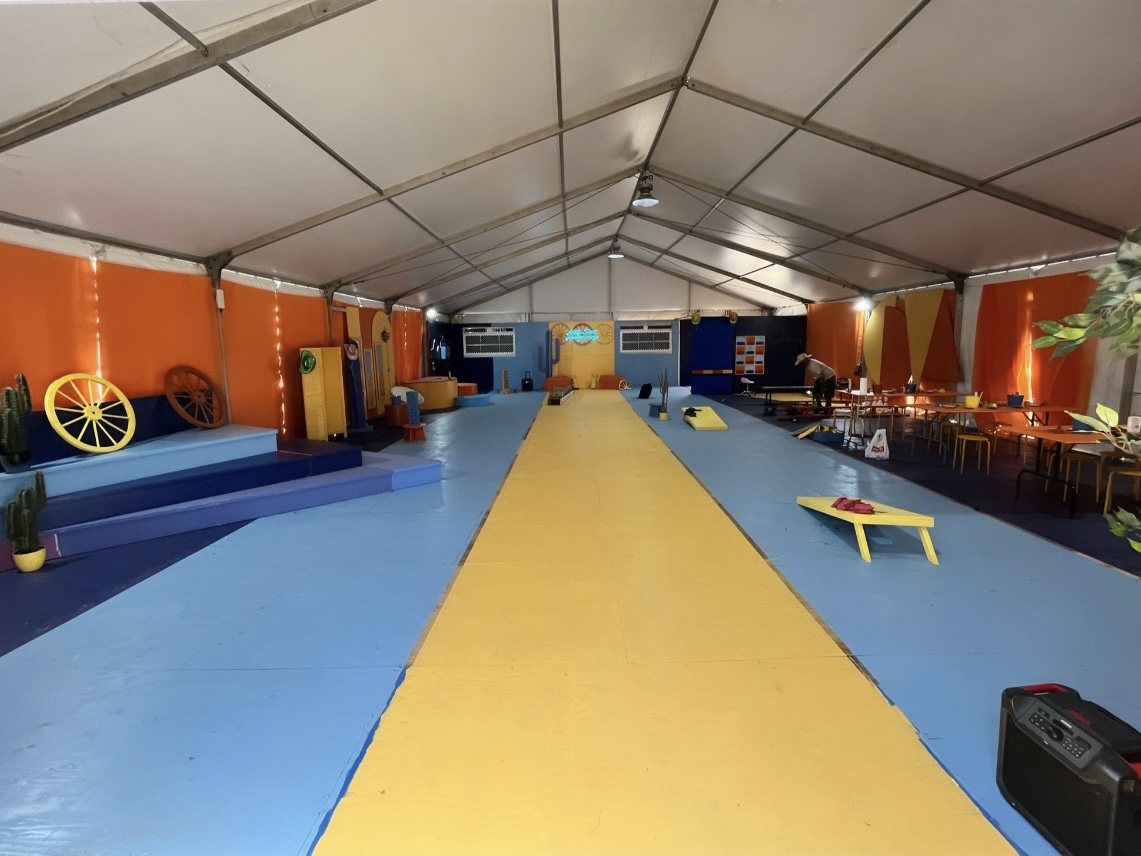 The same tent finished, painted floor, lounge seating and games