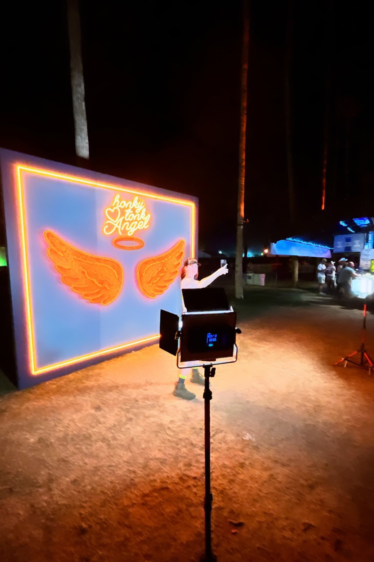 Honky Tonk Angel neon wings photo wall at night